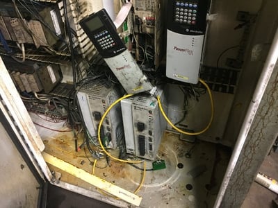 Machine Controls Center with drives covered in oil and dirt